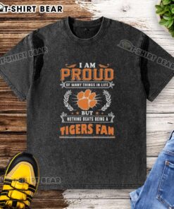 Alt Text: Clemson Tigers fan wearing a washed t-shirt with 'I am proud of many things but nothing beats being a Clemson Tigers fan.'