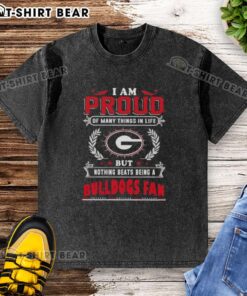 Alt Text: Georgia Bulldogs fan proudly wearing a washed t-shirt that expresses love for the team and school spirit.