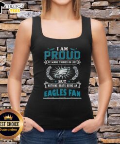 Alt Text: Woman wearing a tank top that says 'Proud to be a Philadelphia Eagles Fan' showcasing team spirit.