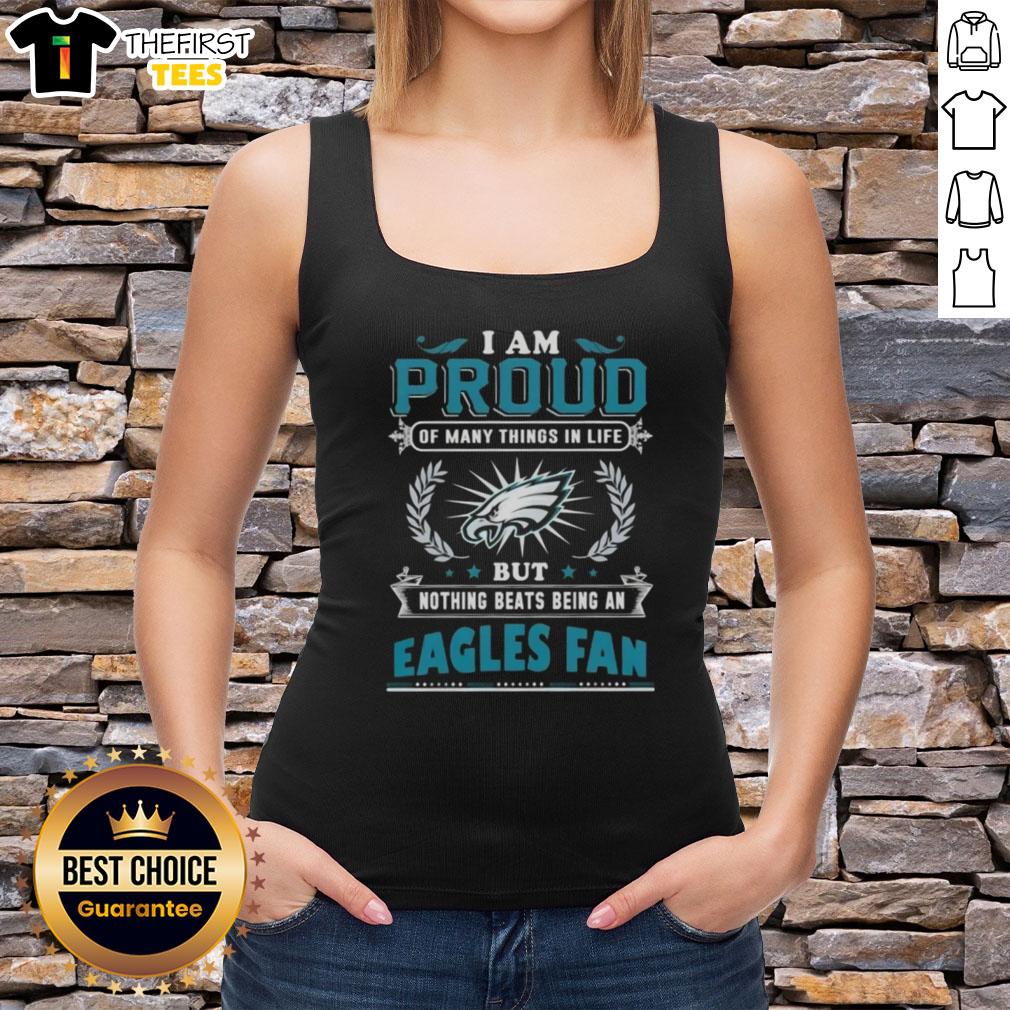 top-i-am-proud-of-many-things-in-life-but-nothing-beats-being-a-philadelphia-eagles-fan-tank-top Alt Text: Woman wearing a tank top that says 'Proud to be a Philadelphia Eagles Fan' showcasing team spirit.