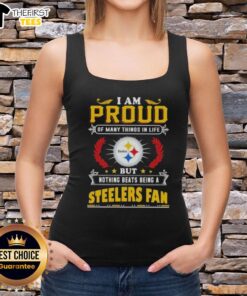 Alt Text: Woman wearing 'I Am Proud Of Many Things But Nothing Beats Being A Pittsburgh Steelers Fan' tank top.