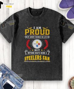 Alt Text: Pittsburgh Steelers fan proudly wearing a washed t-shirt that reads 'I am proud of many things in life, but nothing beats being a Steelers fan.'