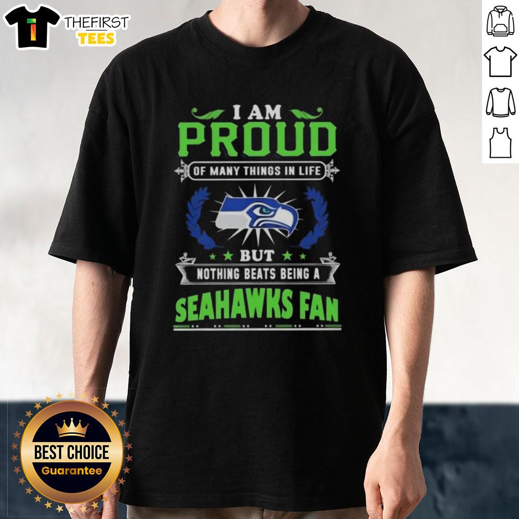 top-i-am-proud-of-many-things-in-life-but-nothing-beats-being-a-seattle-seahawks-fan-t-shirt-1 Alt Text: Seattle Seahawks fan t-shirt featuring the quote: 'I Am Proud Of Many Things In Life But Nothing Beats Being A Fan'