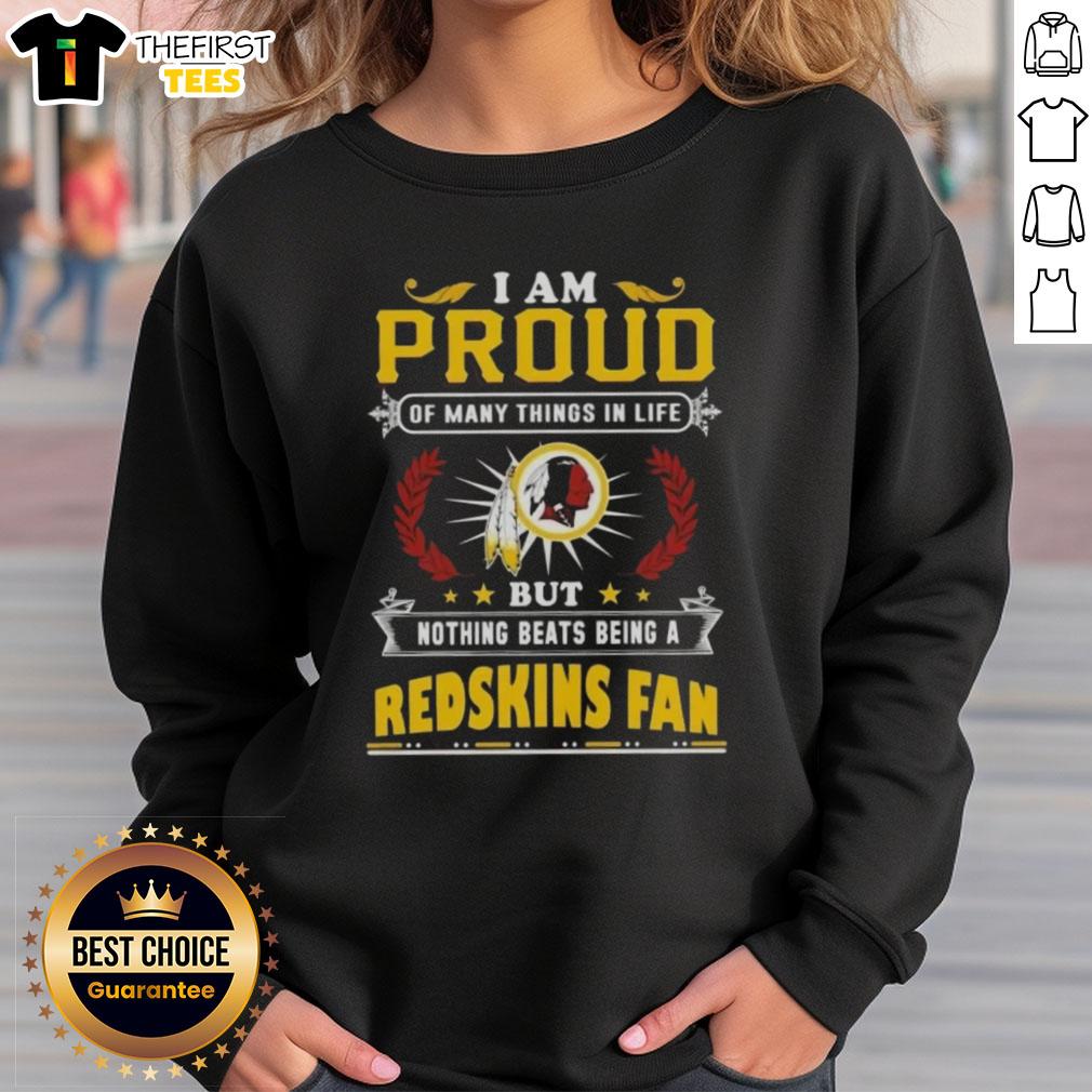 top-i-am-proud-of-many-things-in-life-but-nothing-beats-being-a-washington-redskins-fan-sweatshirt Alt Text: Cozy sweatshirt with I Am Proud Of Many Things, But Nothing Beats Being A Washington Redskins Fan printed on it.