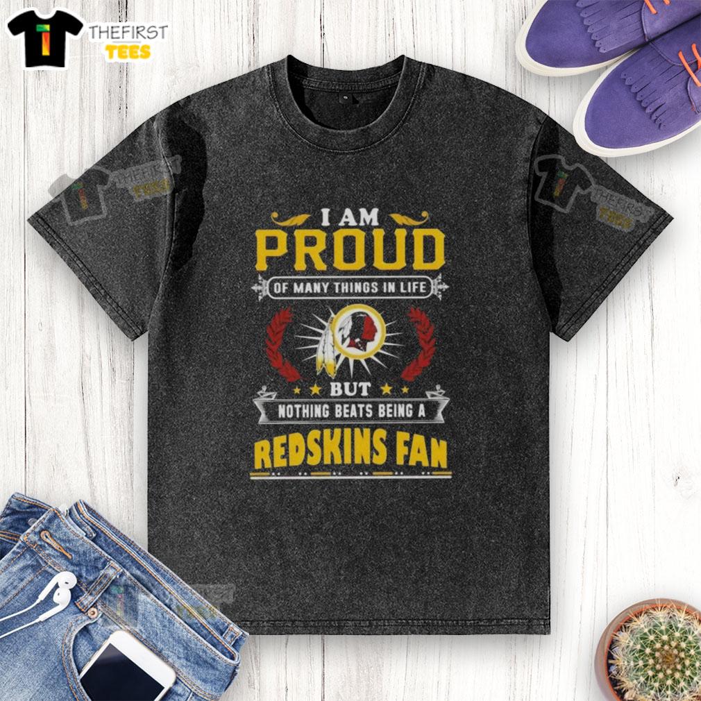 top-i-am-proud-of-many-things-in-life-but-nothing-beats-being-a-washington-redskins-fan-washed-t-shirt Alt Text: Worn Washington Redskins fan t-shirt with the phrase 'I'm Proud of Many Things, But Nothing Beats Being a Redskins Fan.'