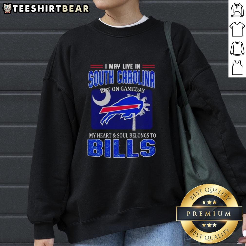 top-i-may-live-in-south-carolina-but-on-gameday-my-heart-and-soul-belongs-to-bills-sweatshirt Cozy Bills sweatshirt with 'I May Live in South Carolina But My Heart Belongs to Bills' design, perfect for game day.