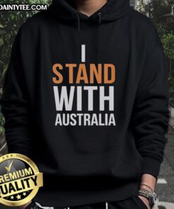 Person wearing 'Stand With Australia' hoodie at Bondi Beach, showcasing support and Australian pride in a vibrant setting.