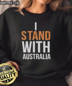 Top I Stand With Australia sweatshirt at Bondi Beach, showcasing vibrant design and beachside views.