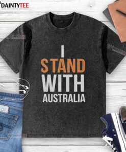 Person wearing 'Stand With Australia' washed t-shirt at Bondi Beach, showcasing beach vibes and support for Australia.