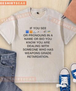 Colorful flags washed T-shirt with pronouns, symbolizing inclusivity and identity in personal bios and names.