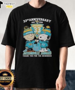 Top Jacksonville Jaguars outfit featuring Snoopy and Charlie Brown 33rd Anniversary 1993-2026 T-Shirt design.