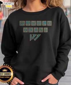 Alt Text: Jaylen Waddle Miami Dolphins Waddle House logo sweatshirt featuring vibrant colors and stylish design.