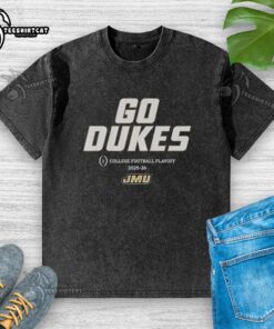 JMU Football 2025 College Football Playoff Team Slogan on a washed t-shirt, showcasing school spirit for Dukes fans.