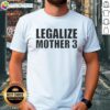 Top Legalize Mother 3 T-Shirt featuring vibrant graphics and bold text, perfect for fans of the classic game.