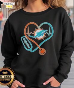 Miami Dolphins sweatshirt featuring stethoscope headphones, perfect for fans showcasing team spirit and style.