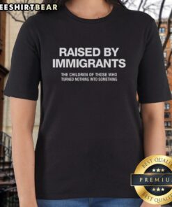 Melissa Ortiz wearing a Raised By Immigrants ladies tee, celebrating the journey of those who turned nothing into something.