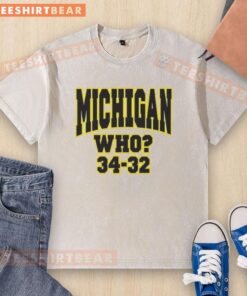 Alt Text: Top Michigan Who 34-32 washed t-shirt featuring a vintage design, perfect for fans and casual wear.