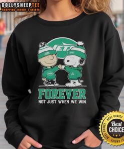 Top New York Jets x Charlie Brown vs Snoopy sweatshirt featuring 'Forever Not Just When We Win' design.