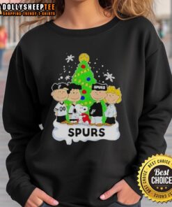 Alt Text: Top Peanuts Comic Christmas Tree graphic on San Antonio Spurs sweatshirt, perfect for holiday sports fans.