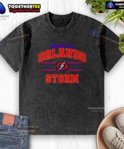 Alt Text: Orlando Storm UFL logo on a washed t-shirt, showcasing the team's branding and stylish design for fans.