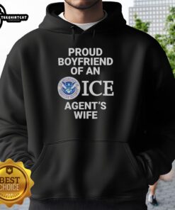Top Proud Boyfriend of an Ice Agent's Wife Hoodie worn by a smiling man in a casual setting, showcasing stylish design.