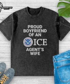 Alt Text: Proud boyfriend wearing a washed T-shirt, celebrating his relationship with an ICE agent's wife in a candid moment.