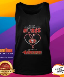 Alt Text: Nurse in a tank top showcasing San Francisco 49ers pride, blending love for football with healthcare passion.