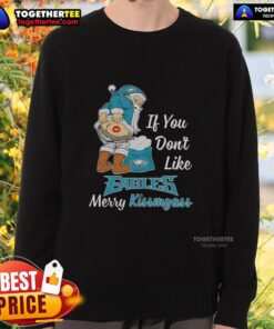 Top Santa Claus sweatshirt featuring 'If You Don't Like Philadelphia Eagles, Merry Kiss My Ass' design for festive fans.
