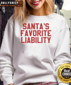 Funny political Christmas sweatshirt featuring Santa and 'Top Santa's Favorite Liability' design for festive humor.