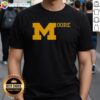 Top Sherrone Moore Michigan Football T-Shirt featuring bold graphics and the team's colors, perfect for fans.