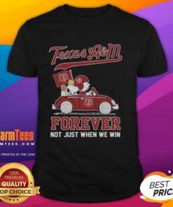 Snoopy and Charlie Brown driving a car on Texas A&M Aggies T-shirt, celebrating fandom beyond just winning.