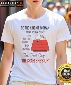 Alt Text: Snoopy graphic t-shirt featuring motivational quote 'Be The Kind Of Woman' in vibrant colors, perfect for daily inspiration.