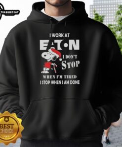 Snoopy hoodie featuring 'I work at Eaton Corporation, I dont stop when Im tired, I stop when Im done' design.