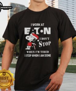 Alt Text: Top Snoopy Christmas T-Shirt for Eaton Corporation - 'I Don't Stop When I'm Tired, I Stop When I'm Done'