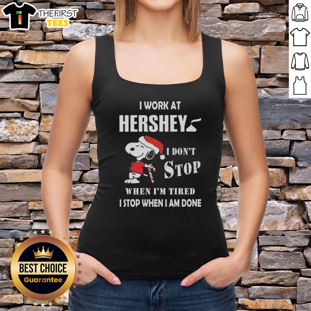 top-snoopy-i-work-at-hershey-i-dont-stop-when-im-tired-i-stop-when-i-am-done-christmas-tank-top Top Snoopy I Work At Hershey Christmas Tank Top featuring Snoopy with a motivational quote for holiday spirit.