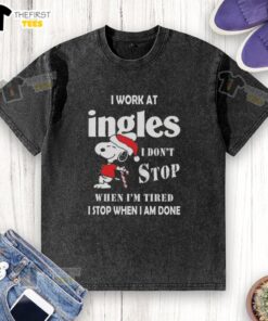 Alt Text: Snoopy graphic t-shirt for Christmas featuring 'I work at Ingles Markets, I don't stop when I'm tired' slogan.