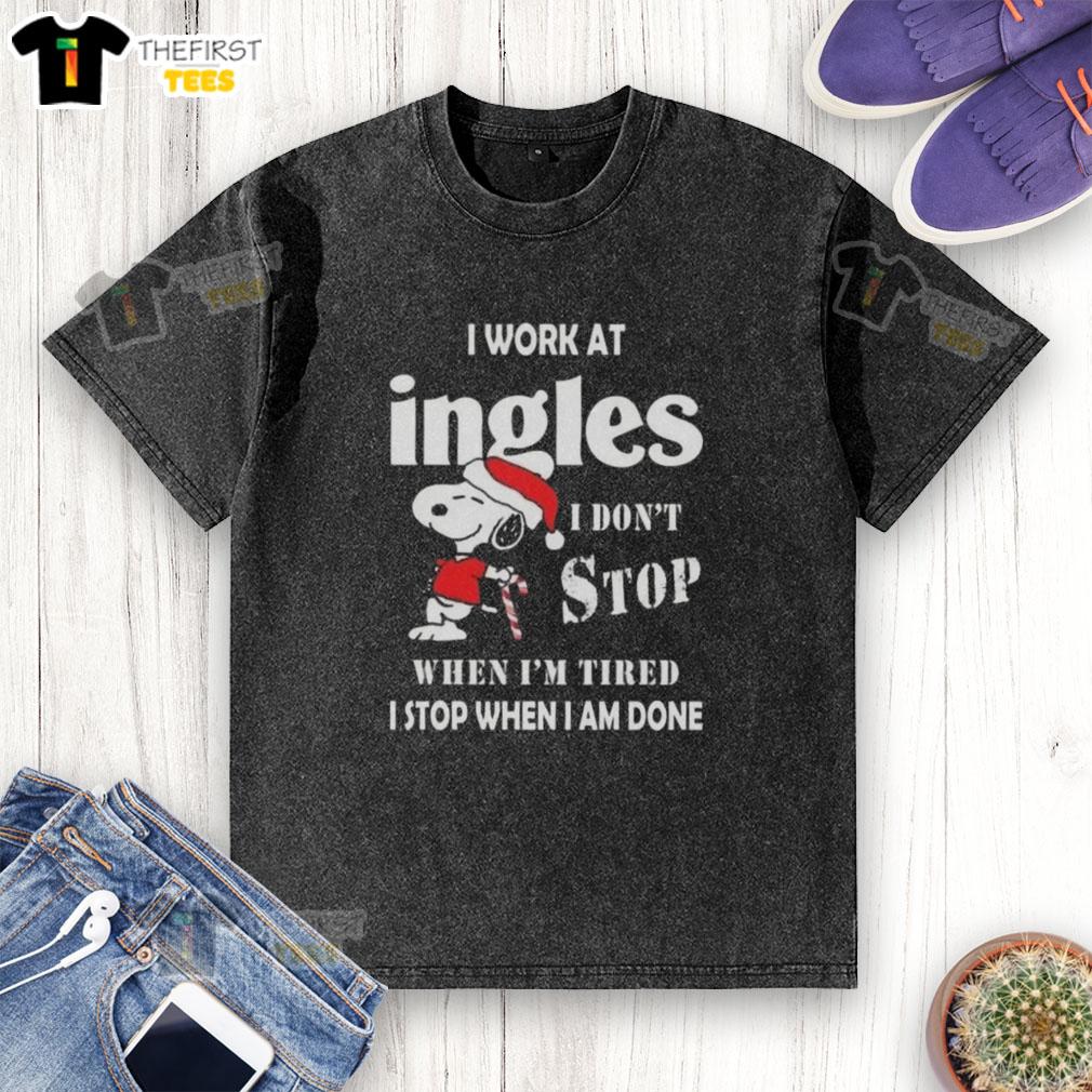 top-snoopy-i-work-at-ingles-markets-i-dont-stop-when-im-tired-i-stop-when-i-am-done-christmas-washed-t-shirt Alt Text: Snoopy graphic t-shirt for Christmas featuring 'I work at Ingles Markets, I don't stop when I'm tired' slogan.