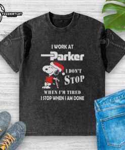 Alt Text: Snoopy Christmas t-shirt featuring 'I work at Parker Hannifin, I dont stop when Im tired, I stop when Im done' design.
