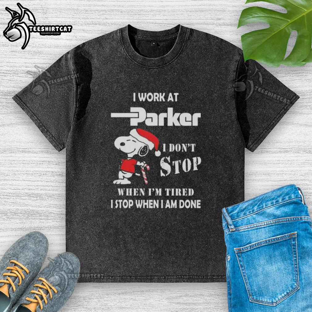 top-snoopy-i-work-at-parker-hannifin-i-dont-stop-when-im-tired-i-stop-when-i-am-done-christmas-washed-t-shirt Alt Text: Snoopy Christmas t-shirt featuring 'I work at Parker Hannifin, I dont stop when Im tired, I stop when Im done' design.