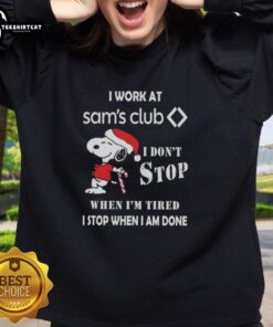 Top Snoopy I Work At Sam's Club Christmas sweatshirt featuring a motivational quote and festive design.