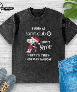 Alt Text: Snoopy I Work At Sam's Club T-shirt featuring Christmas theme, saying 'I don't stop when I'm tired, I stop when I'm done.'
