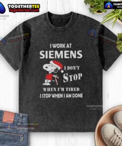 Alt Text: Funny Snoopy Christmas T-shirt with 'I Work At Siemens, I Dont Stop When Im Tired' slogan, perfect for holidays.