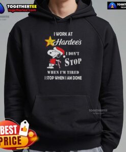 Alt Text: Snoopy Christmas hoodie with 'I work at Hardee's, I dont stop when Im tired, I stop when Im done' design.