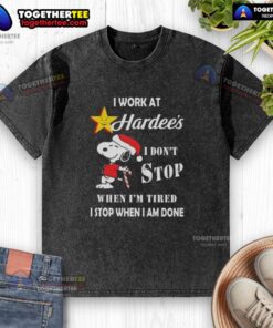 Alt Text: Snoopy Christmas T-shirt featuring 'I work at Hardee's, I don't stop when I'm tired, I stop when I'm done' slogan.