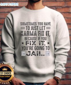 Cozy sweatshirt with 'Sometimes You Just Have To Let Karma Fix It' quote, perfect for casual wear and karma enthusiasts.