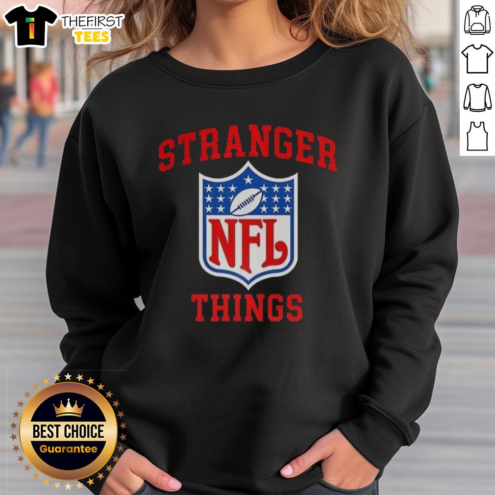 top-stranger-things-x-nfl-logo-sweatshirt Top Stranger Things X NFL logo sweatshirt featuring a unique design combining iconic TV show and football elements.