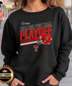 Alt Text: Top Texas Tech Red Raiders 2025 CFB Playoff stripe football helmet sweatshirt displayed on a wooden background.