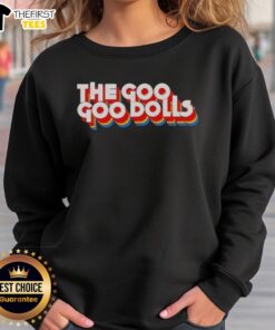 Alt Text: Neil Barrow wearing the Top The Diplomat Goo Sweatshirt, showcasing its unique design and stylish fit.