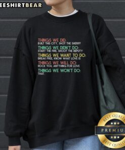 Cozy sweatshirt featuring 'Start The Fire, Shoot The Deputy' design, perfect for fans of local culture and city pride.