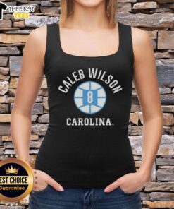 Caleb Wilson wearing a UNC Tar Heels basketball tank top, showcasing his name and number on the court.